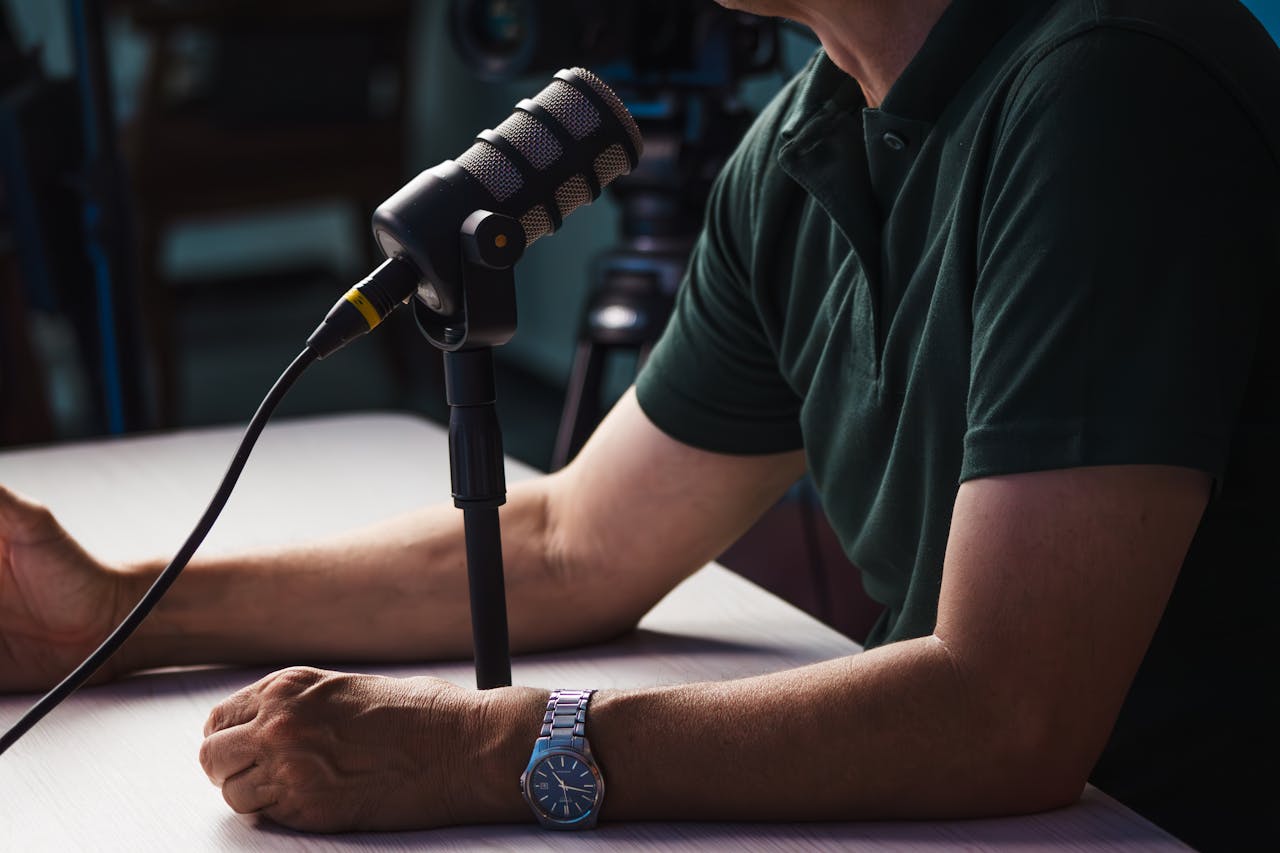 home-hero Man Speaking into Microphone for Podcast or Recording